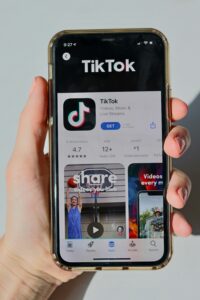 iPhone screen showing TikTok in app store.